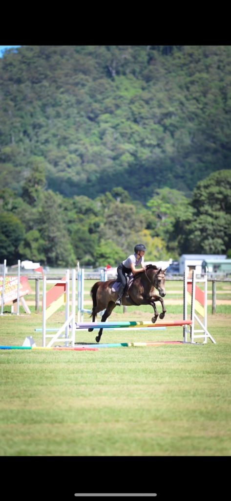 SEG rider clearing a jump during a showjumping event