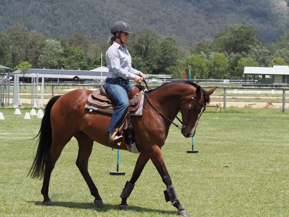 Rider in western attire on horse practising Western Dressage at SEG